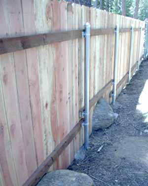 wood fence with steel posts